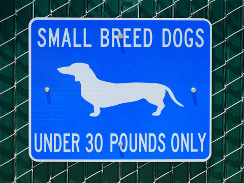 Dog park sign small breed dogs only.