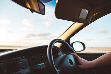 Driving a car into the sunset