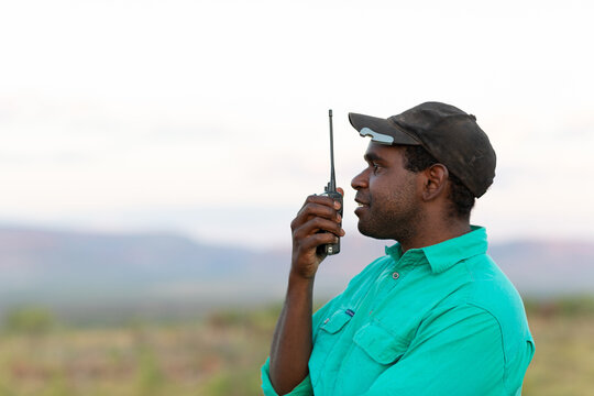 Man in the outback taking on two-way-radio