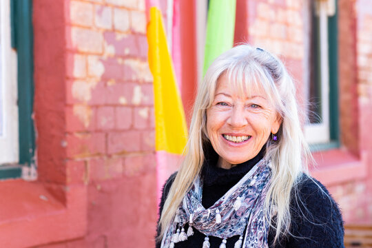 Mature Woman With Long Hair Head And Shoulders View Looking At Camera