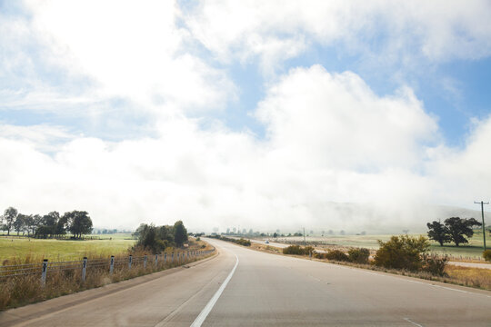 Empty open road and fog ahead on highway