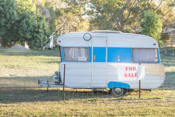 A retro caravan for sale on the roadside
