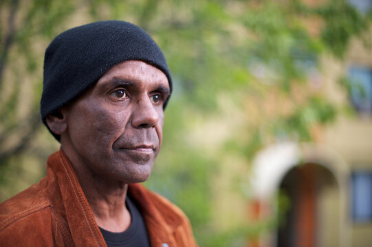 Aboriginal Man in his Forties, Tree in Background