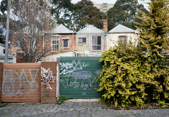 Rundown Collingwood Townhouses viewed from Back Lane