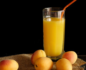 glass of orange juice and fruits
