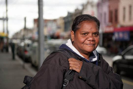 Aboriginal Woman on a Shopping Strip Footpath