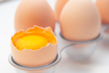 Fresh Eggs in the refrigerator tray. Six homemade eggs. White background. isolate.