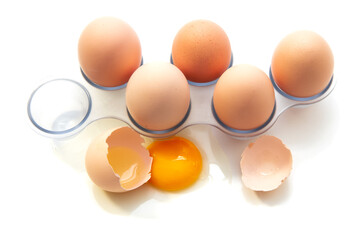 Fresh Eggs in the refrigerator tray. Six homemade eggs. White background. isolate.