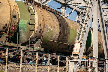 Naklejka premium Transportation of crude oil in barrels by rail.
