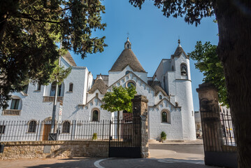 A view towards the parish church of San Antonio in Alberobello, Italy