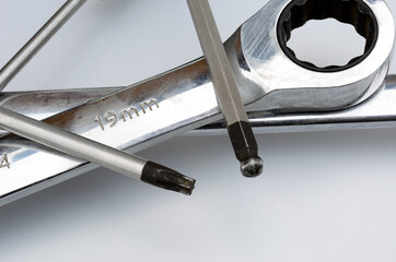 Wrench with ratchet function and ubraco and torx tool isolated on white background