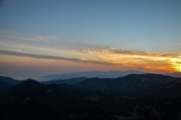 Beautiful mountain landscape with sunset over Taurus Mountains from the top of Tahtali Mountain near Kemer, Antalya, Turkey. 