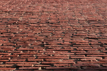 background from an old red brick wall in sunny weather
