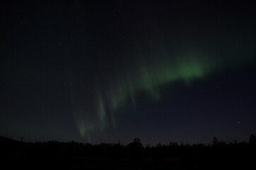 Fototapeta na wymiar aurora borealis on arctic autumn night sky