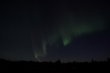 Fototapeta na wymiar aurora borealis on arctic autumn night sky