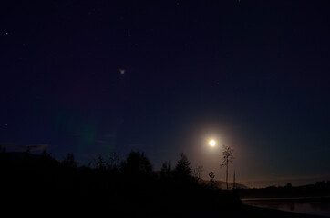 full moon river landscape at night with cold mist over water