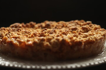 Apple, pie, tatsy. Selective focus of gluten free apple crisp pie on a dark background. Autumn concept.