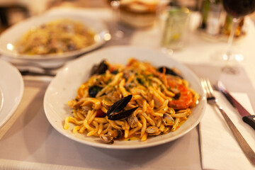 Pasta with seafood and tomatoes
