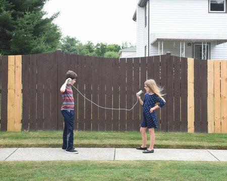 Children Playing With Can Phones