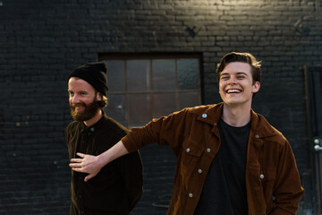 Two men laughing together