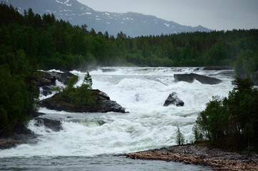 majestic and mighty waterfall in salmon river in northern norway