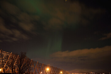 beautiful aurora borealis over a stockfish structure in the arctic circle on a late autumn night
