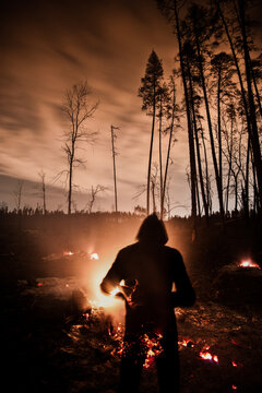 Silhouette against Forest fire at night - long exposure shot