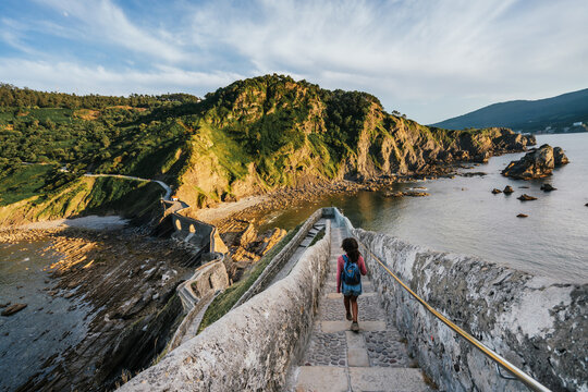 Curly hair woman exploring the majestic place where was filmed Games of thrones.