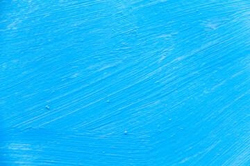 The texture of the iron sheet. The panel is painted with bright blue enamel paint. Abstract brush...