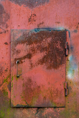Old iron painted rusty door. close-up place for text