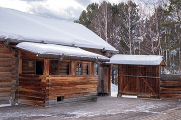 Old peasant farmstead in winter.