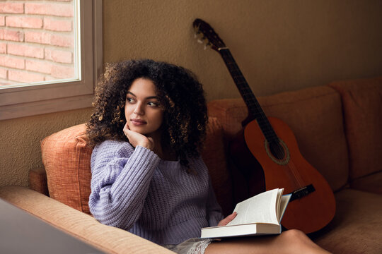 Female student reading at home