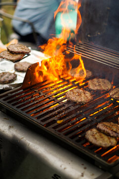 Burgers Cooking On BBQ