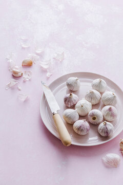 Garlic Bulbs on Pink Background