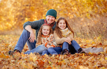 Fototapeta premium Sitting in autumn leaves