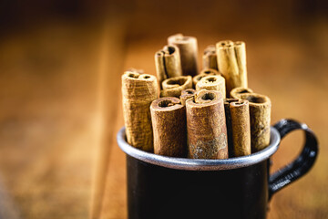 cinnamon bark, inside a coffee mug from Minas Gerais. Cinnamon grown in Brazil.