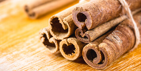 cinnamon bark, used in teas, sweets, as a flavoring or culinary ingredient. Cinnamon on rustic...