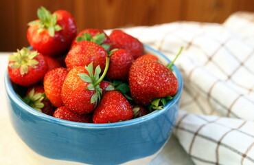 plate with a mound of freshly picked strawberries