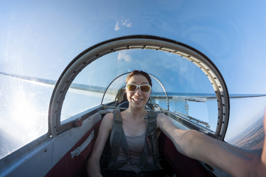 Female taking selfie while flying in a glider