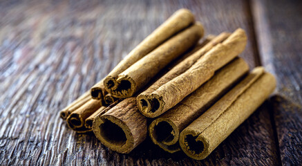 bark cinnamon cut into small piles. Cinnamon, culinary spice.