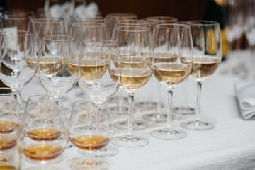 Festive glasses on the festive table during the Banquet. Alcoholic beverage