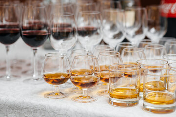 Festive glasses on the festive table during the Banquet. Alcoholic beverage