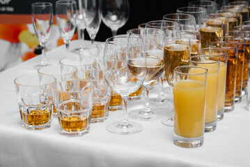 Festive glasses on the festive table during the Banquet. Alcoholic beverage