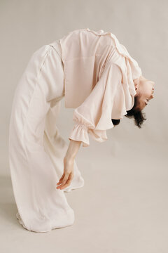 Slim ethnic lady bending and dancing