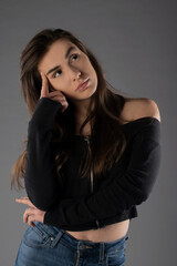 Fototapeta premium Girl posing on grey background. Isolated