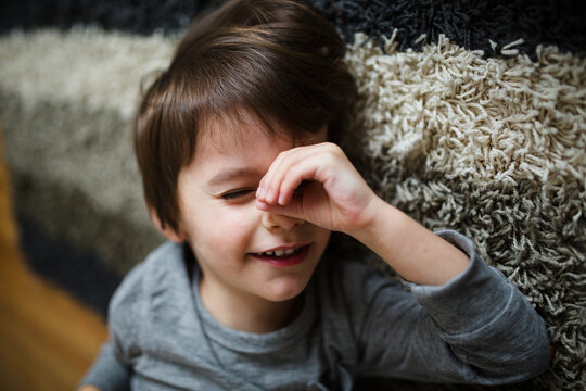 boy looks through pretend telescope