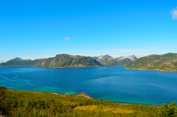 Fototapeta na wymiar deep blue fjord and mighty mountains