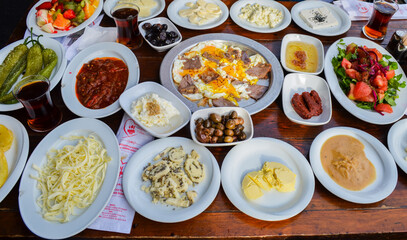 diyarbakır breakfast table, kurdish culture breakfast, cheese, jam, honey, fruit, egg, tea, olive,
