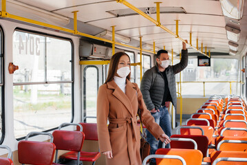 Fototapeta na wymiar Passengers on public transport during the coronavirus pandemic keep their distance from each other. Protection and prevention covid 19
