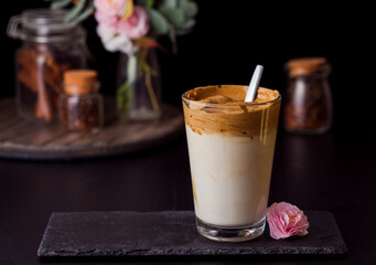 Fluffy instant coffee with cold milk in glass cup